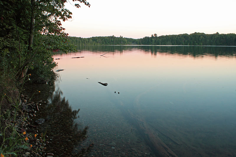 the sun setting over petes lake